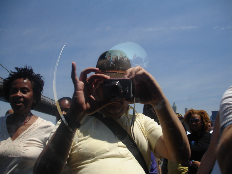 Self Portrait of Ruben Taking a Picture through the Glass of the Optical exhibit at Fulton Ferry
